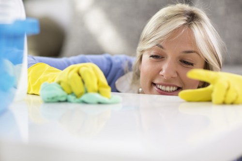 Carpet cleaners preparing a safe cleaning setup in E15