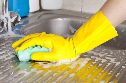 Professional carpet cleaning team working safely in E15
