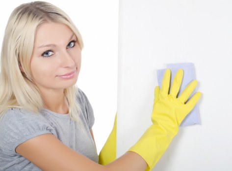 Trained technician using PPE during carpet cleaning
